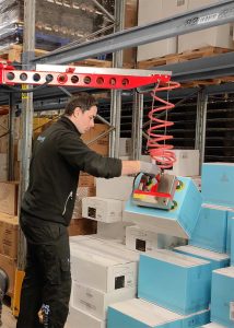 Speedy Picker crane arm for warehouse trucks can easily reach inside of shelves